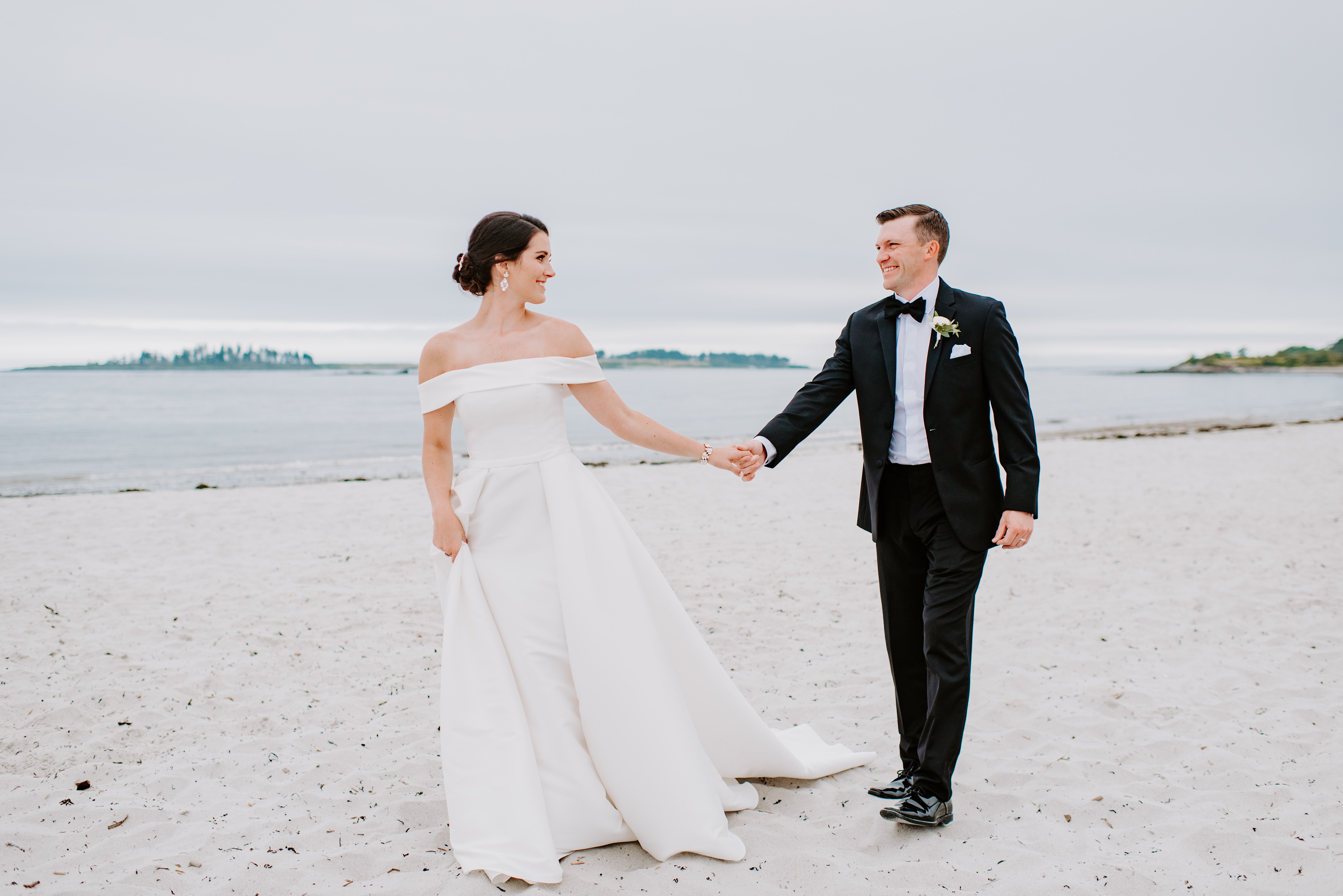 Sneak Peek Of Bride And Groom On Beach